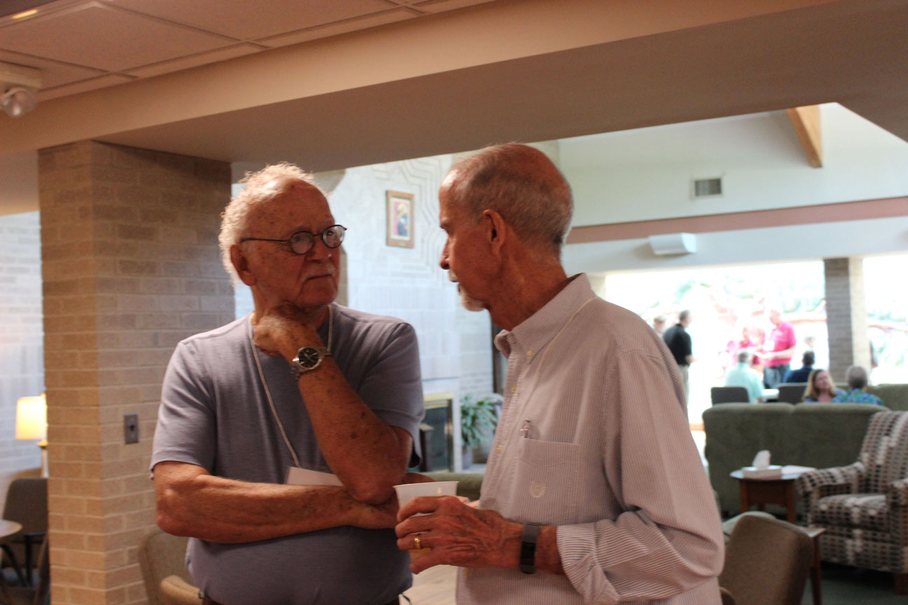Pat Hanson and Don Noltemeyer share a conversation.