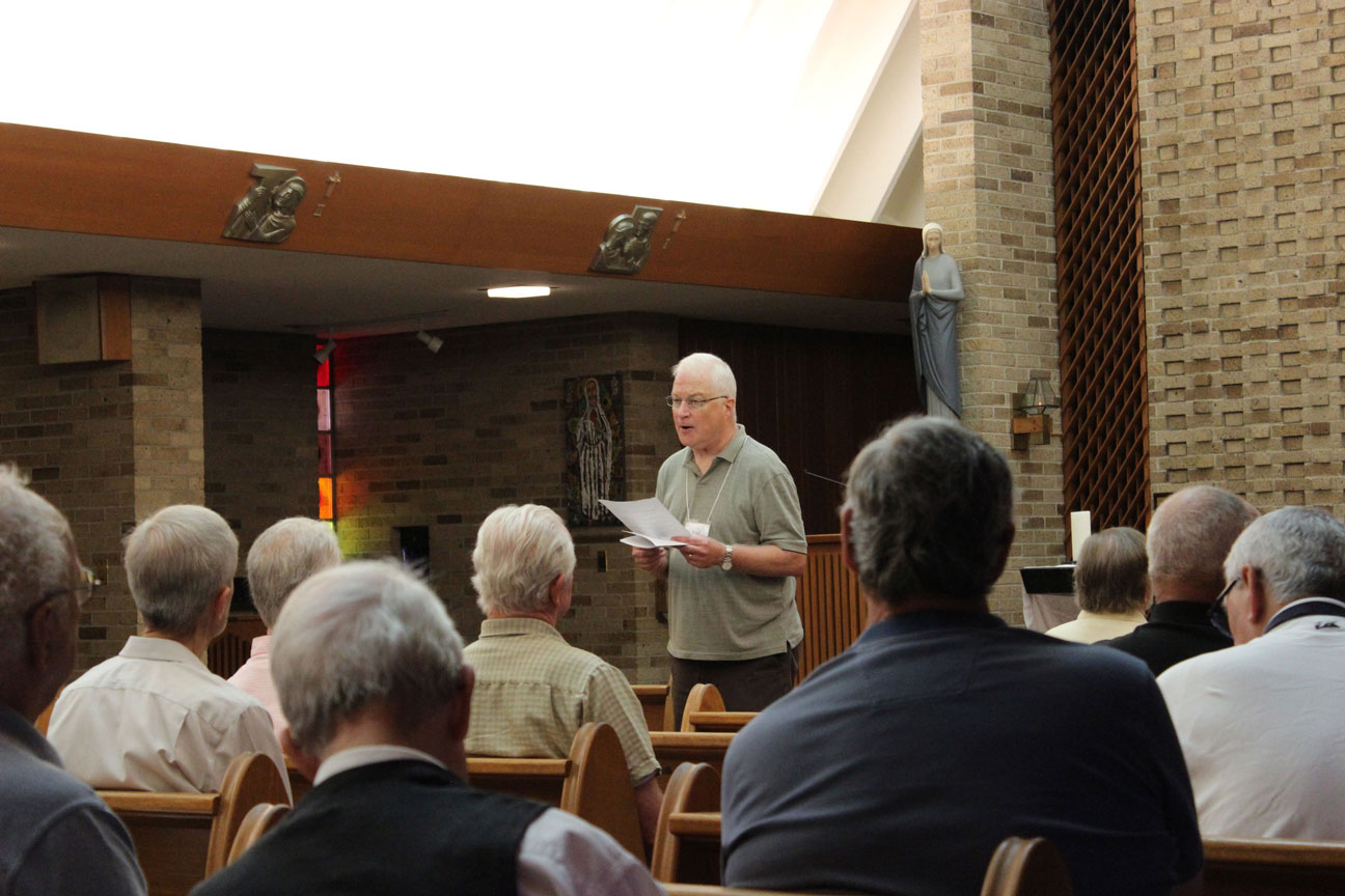 Paul Wadell proclaimed the Scripture reading during the prayer service.