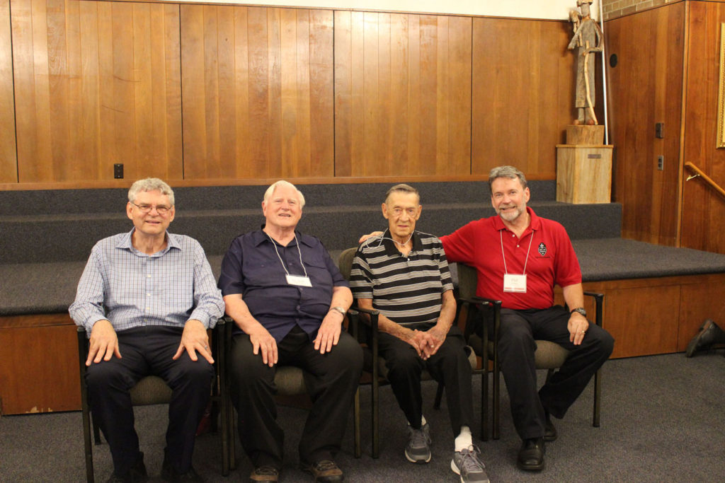 Frank Mullally (second from right), Prep Class of '49, with his honorary classmates, Fr. Joe Moons, CP, Fr. Bob Weiss, CP, and Phil Jackson.