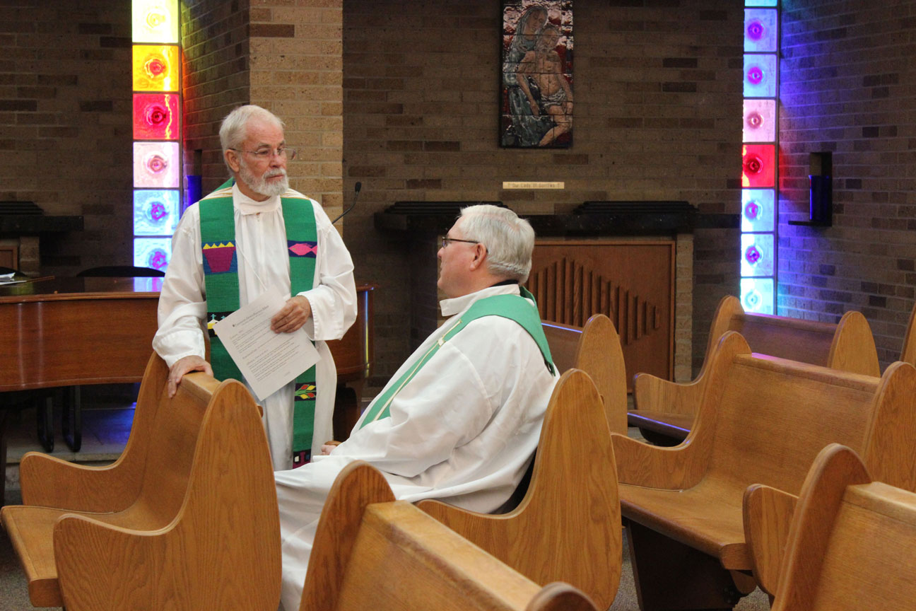 Fr. Bob Knight and Fr. Richard Crager, SDB, chat before Mass.