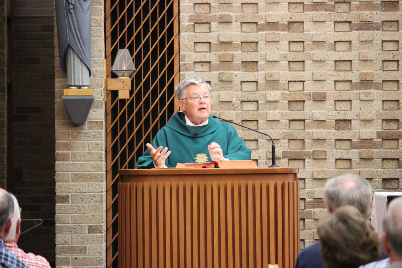 Fr. John Schork, CP, proclaimed the Gospel.