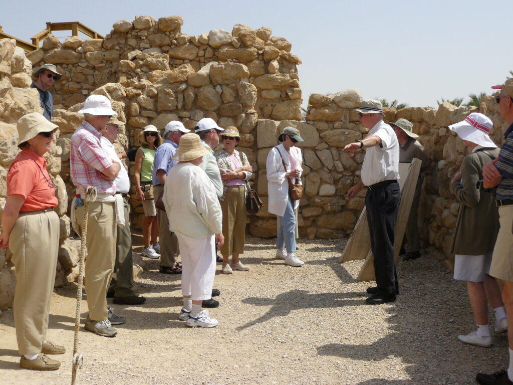 Father Don discusses ruins in Masada.