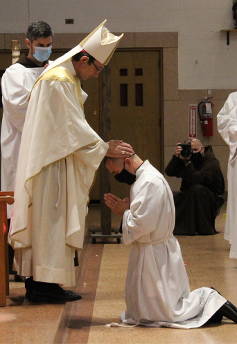 Bishop Bartosic laying on of hands over Nicholas Divine.