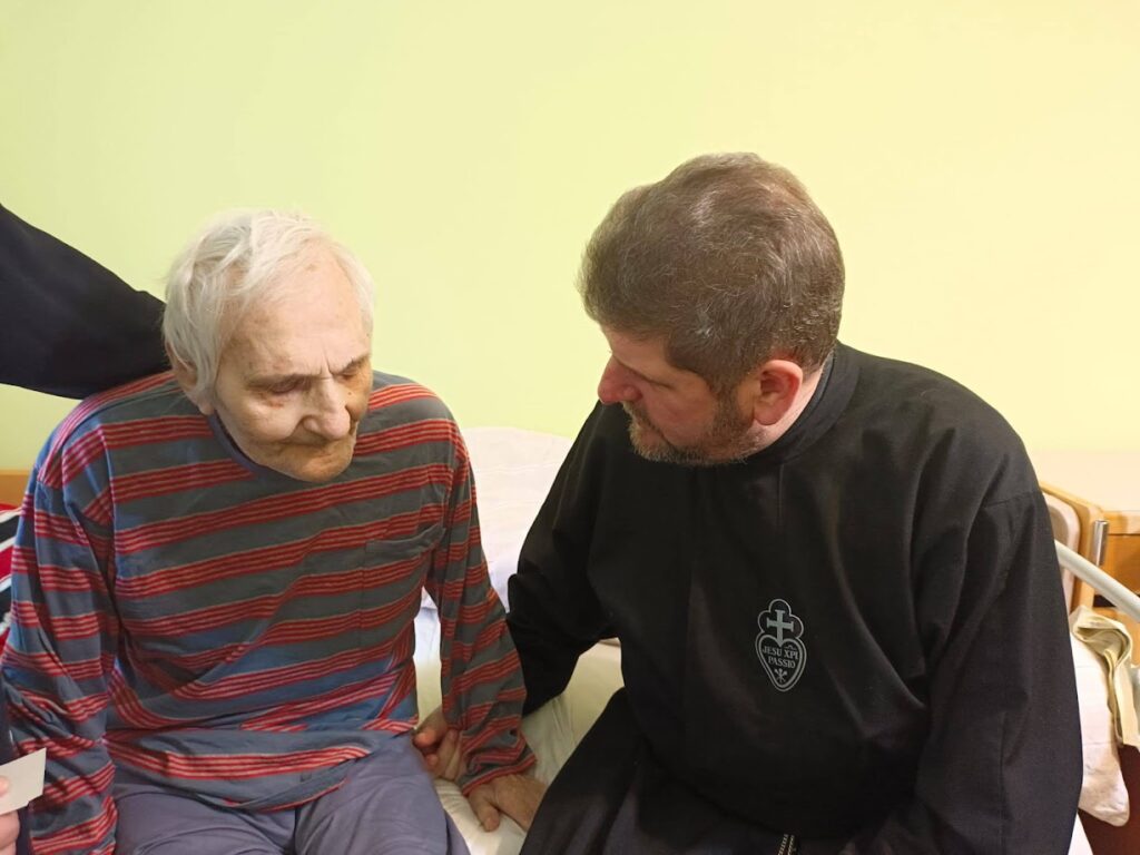 A Passionist helps a man in Ukraine