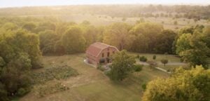 Aerial shot of the Passionist Earth and Spirit Center in Louisville, KY with the sun shining