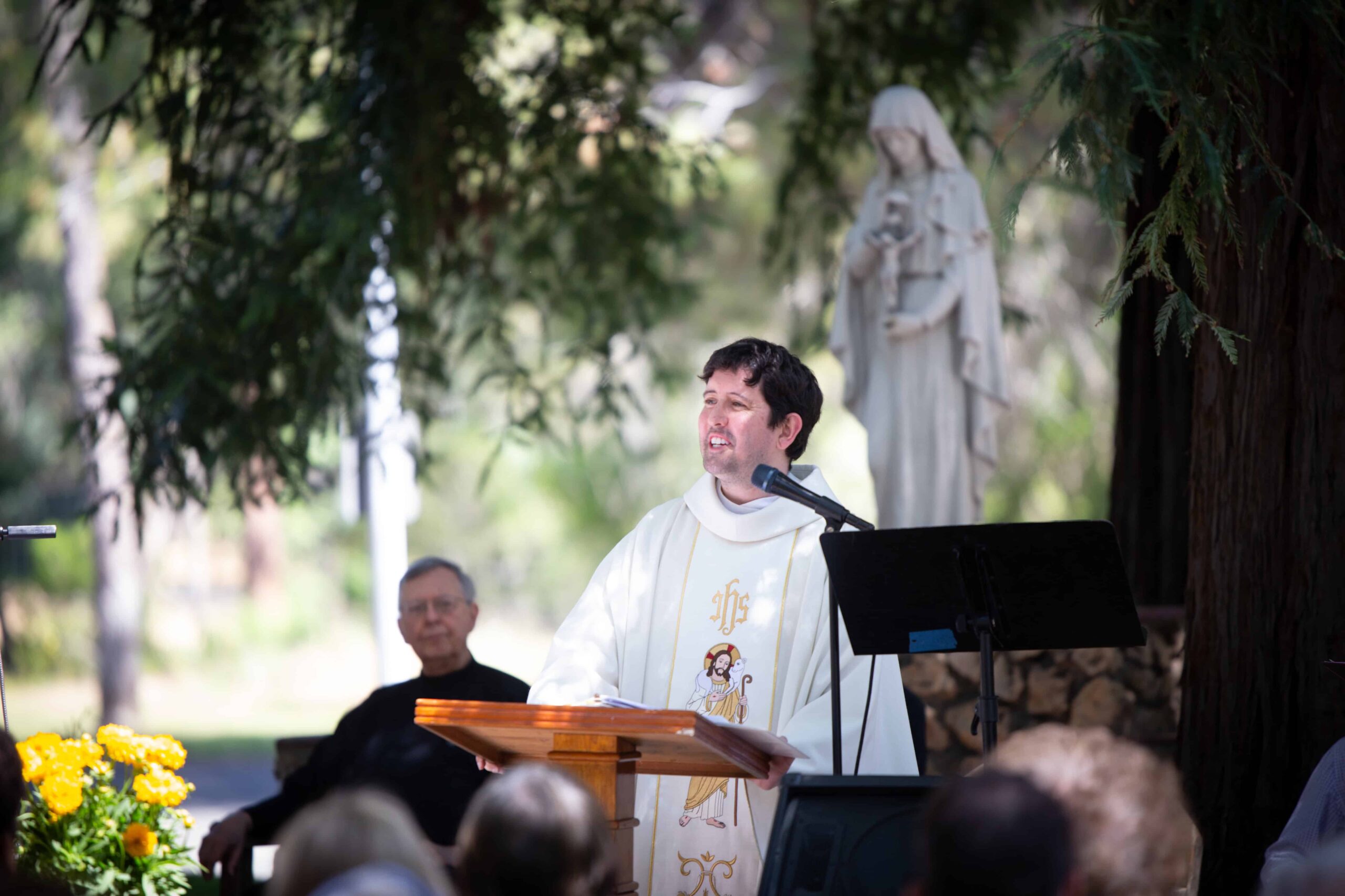 A Passionist priest preaches outside in California