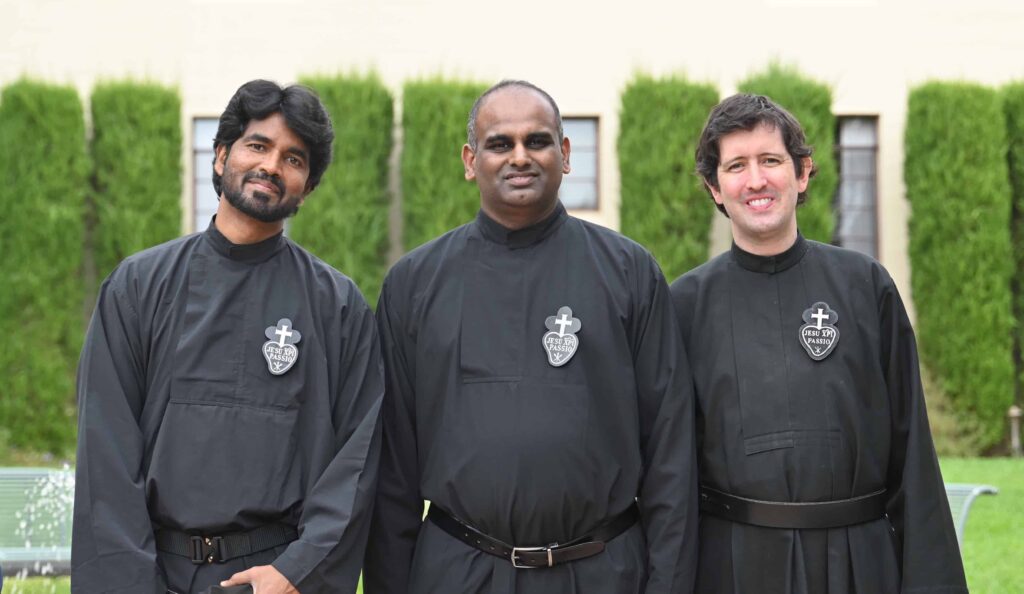 Three smiling Passionist priests