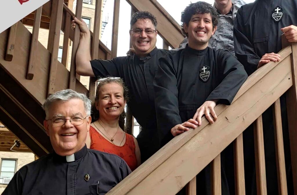Smiling Passionists on the steps at their house of formation studies