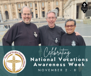Three smiling Passionists in a stone courtyard in Rome