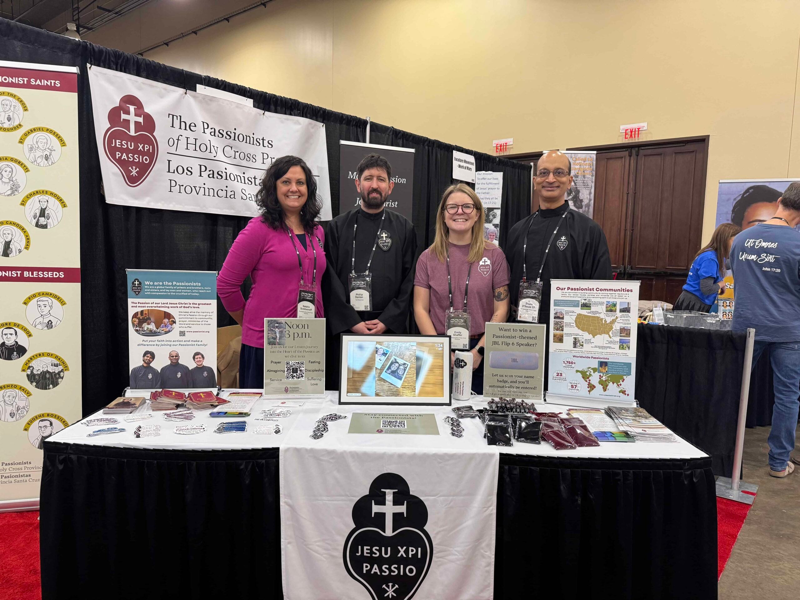 4 smiling people in an exhibition booth for the Passionists at the SEEK 2026 Conference