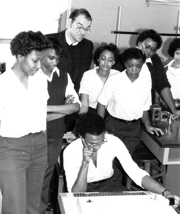A Passionist priest teaches a class of students in Birmingham, AL